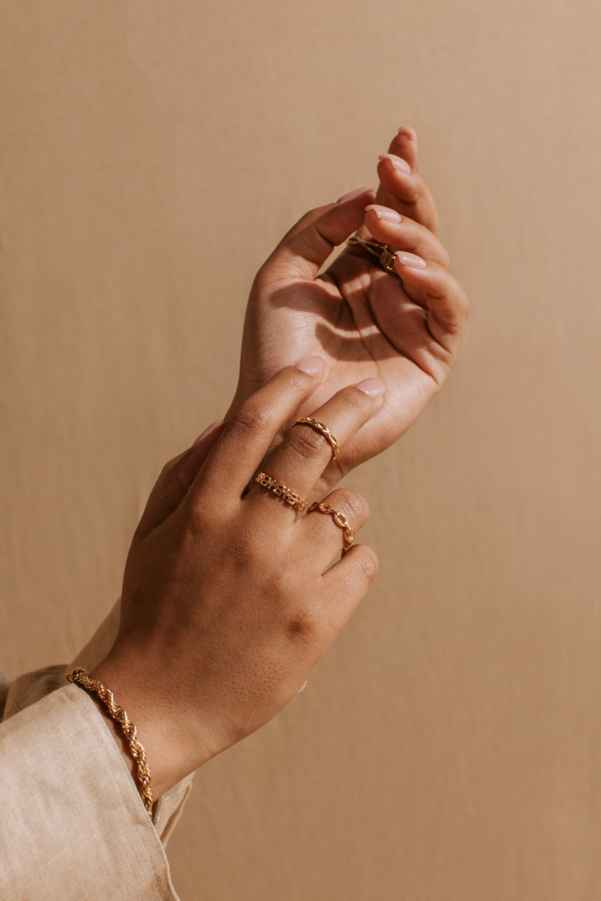 Woman Wearing Gold Jewelry