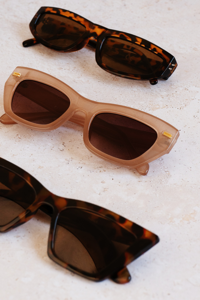 Brown Sunglasses on Marble Background